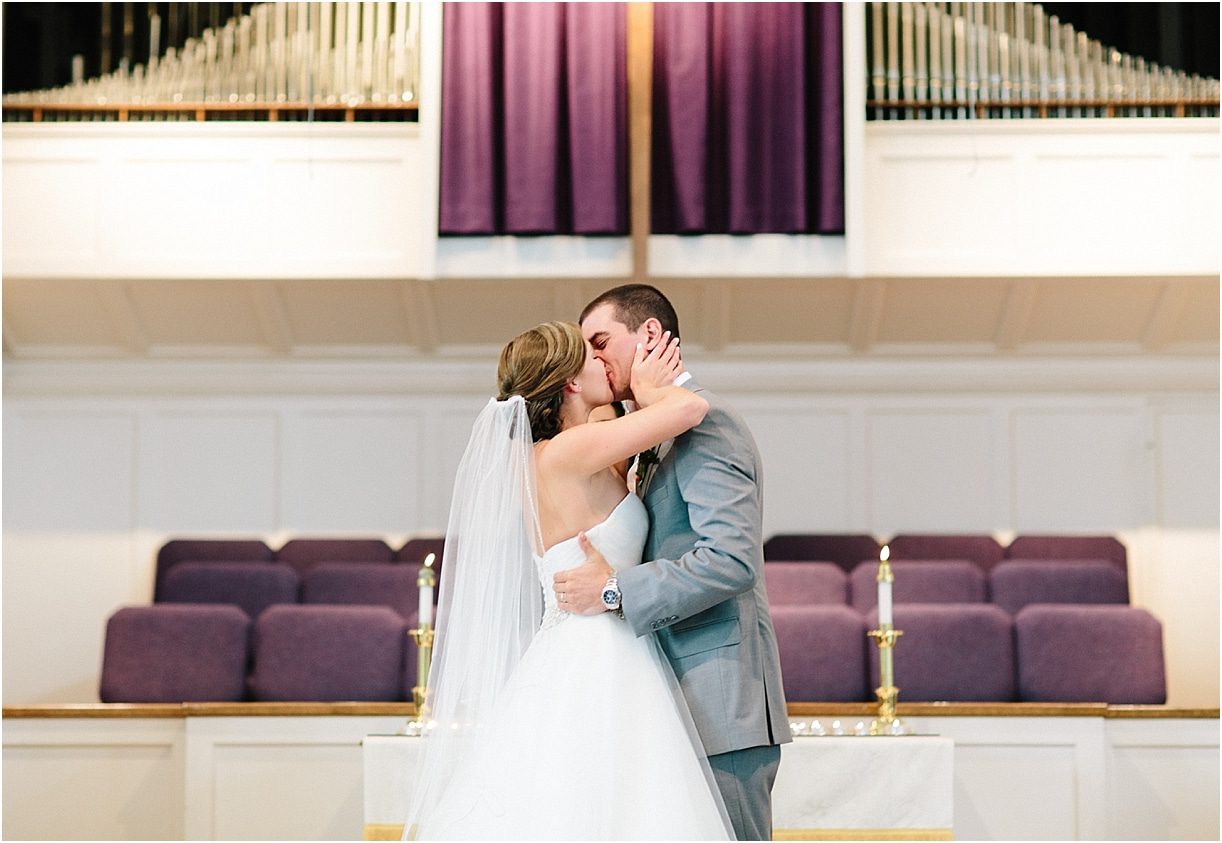 A Pink and Aqua Roanoke Virginia Wedding as seen on Hill City Bride Blog and Magazine - first kiss