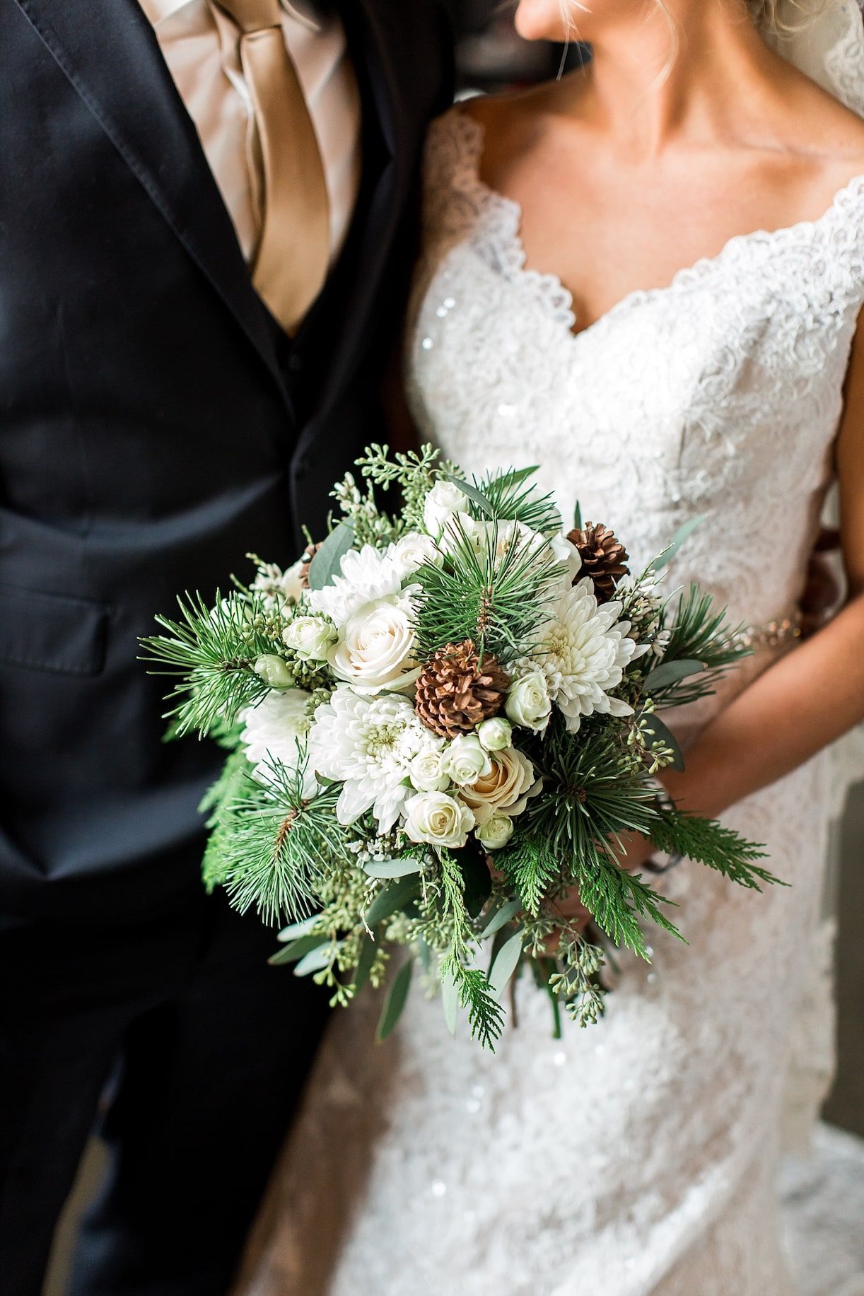 White Winter Wedding Bouquets with Pine Cones