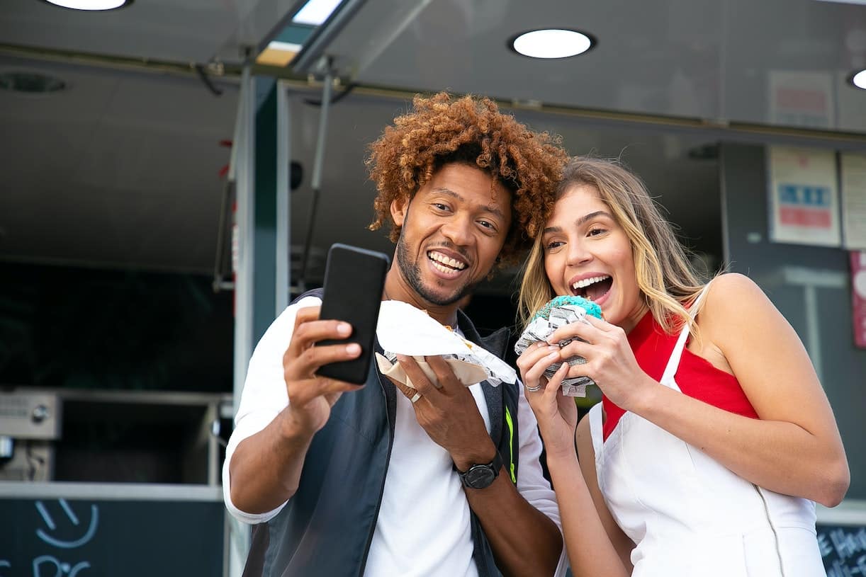 Mixed Couple Taking Selfie on Road Trip