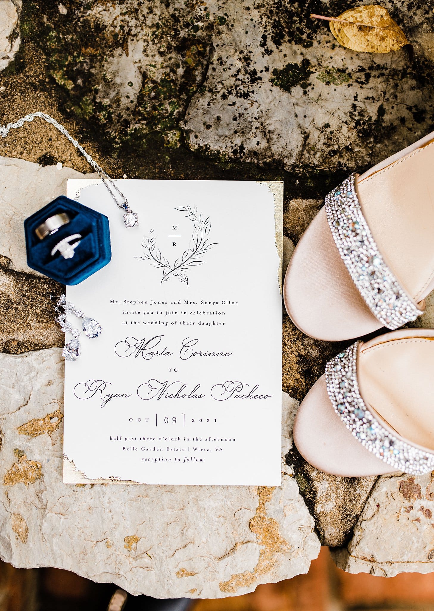 Red and Pink Wedding Theme Shoes Flatlay Invitation Rings